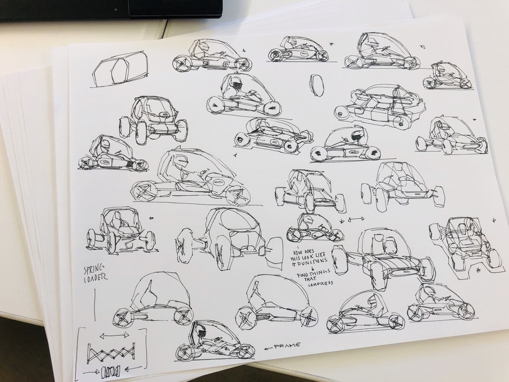 Concept ideation sheets — ballpoint sketches exploring vehicle architecture